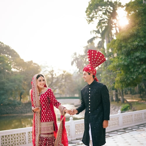 A couple holding hands at their wedding